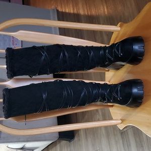Brand new black knee high platform boots.